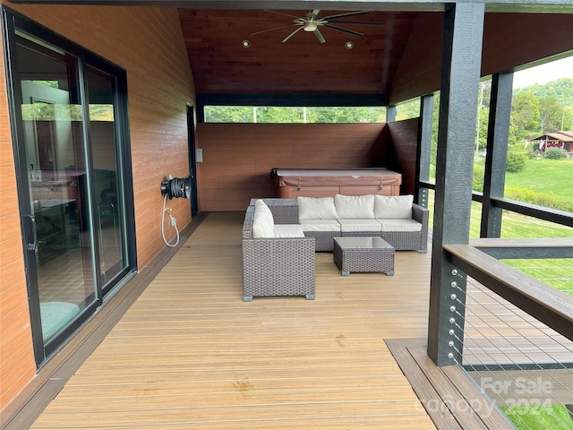 sunroom featuring wooden ceiling, a hot tub, and vaulted ceiling