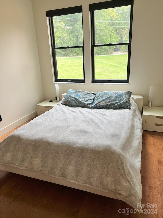 bedroom featuring dark hardwood / wood-style floors