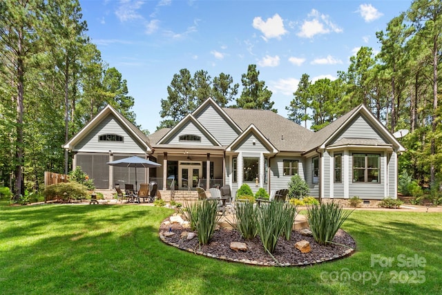 back of property featuring ceiling fan, a yard, a patio, and french doors