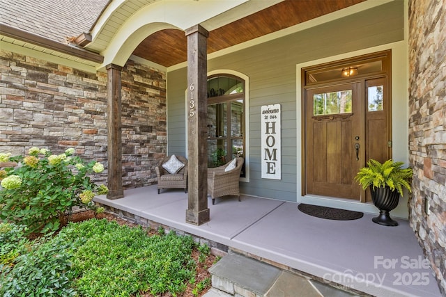 entrance to property featuring covered porch