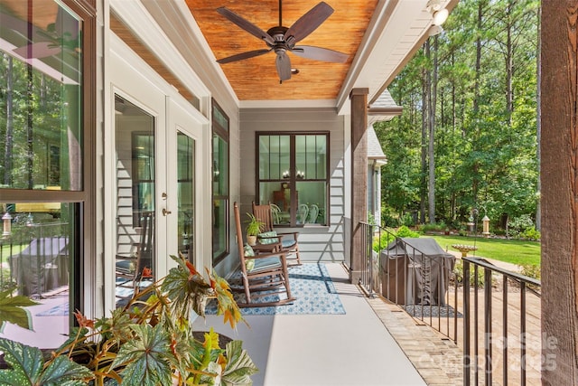 exterior space featuring french doors, a porch, and ceiling fan