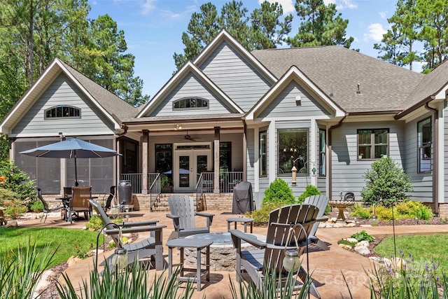 back of property featuring ceiling fan, a patio area, and french doors