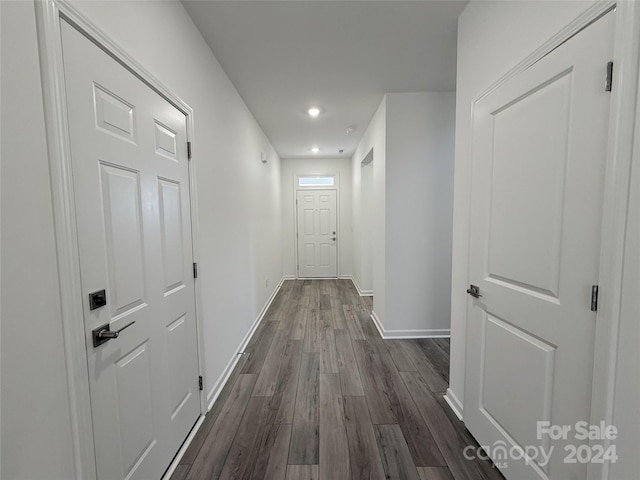 hallway with dark wood-type flooring