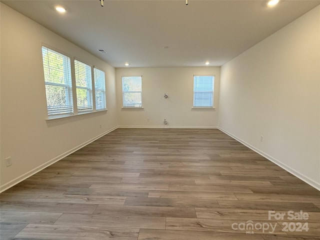 spare room with light hardwood / wood-style flooring