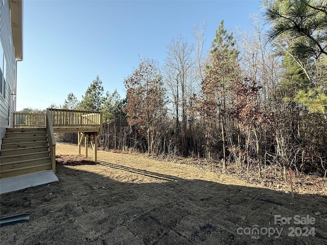 view of yard featuring a wooden deck