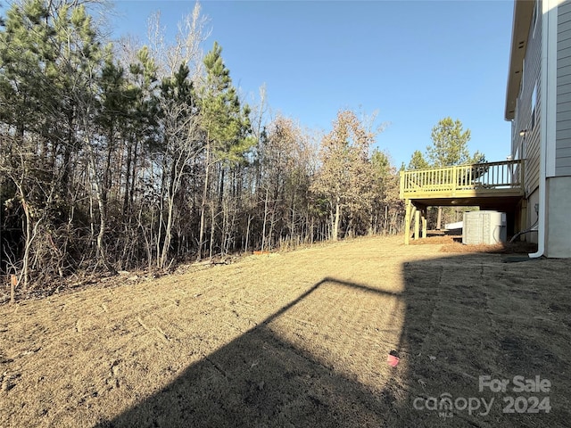 view of yard featuring a wooden deck