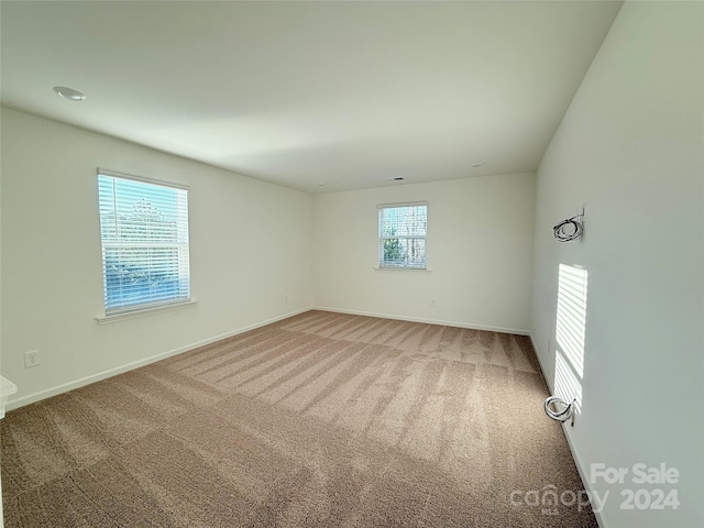 unfurnished room featuring carpet floors