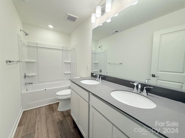 full bathroom featuring shower / bath combination, vanity, toilet, and wood-type flooring