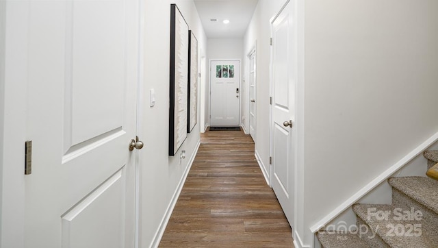 corridor with dark wood-type flooring