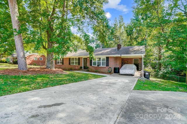 ranch-style home with a front lawn