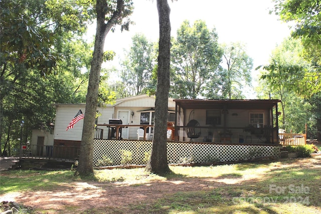 rear view of house with a deck