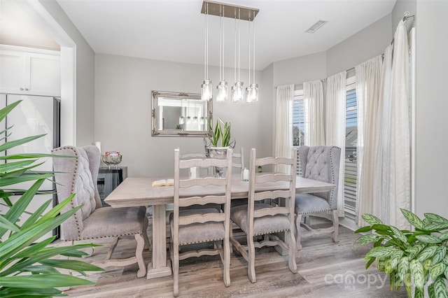 dining space featuring light hardwood / wood-style floors