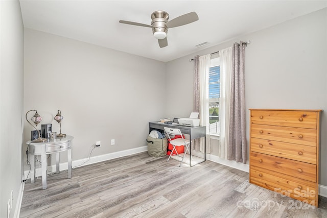 interior space featuring ceiling fan and light wood-type flooring