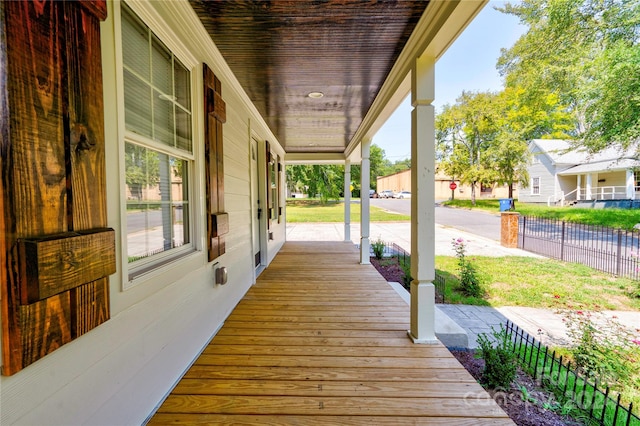 wooden terrace with a porch