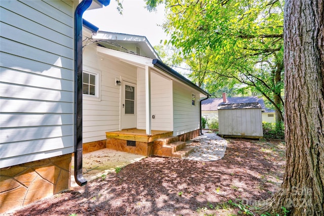 view of patio featuring a shed