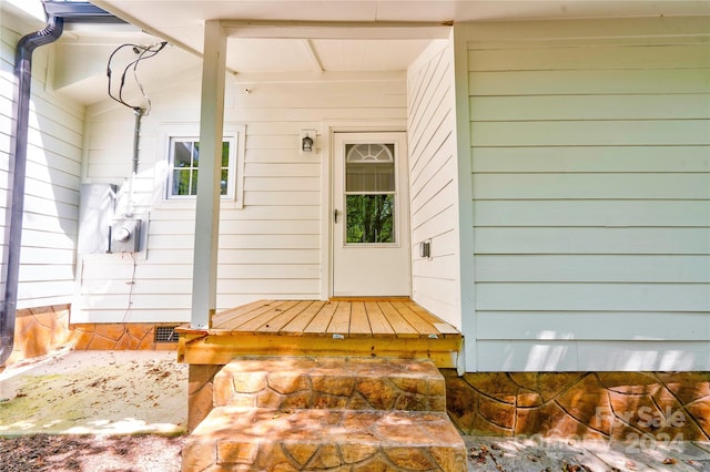 view of exterior entry with covered porch