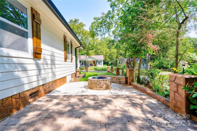 view of patio / terrace with a fire pit