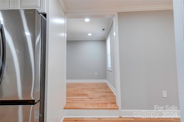 interior space featuring visible vents, recessed lighting, ornamental molding, and freestanding refrigerator