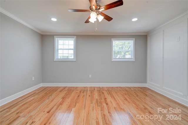 spare room featuring crown molding, light hardwood / wood-style flooring, and ceiling fan