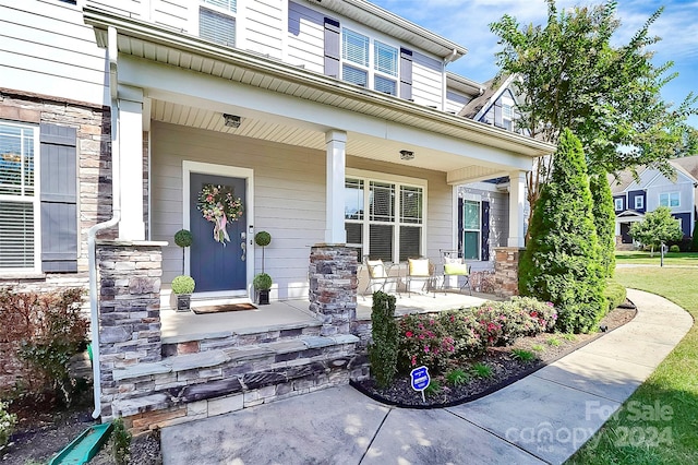 entrance to property with covered porch