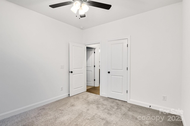 unfurnished room featuring carpet and ceiling fan