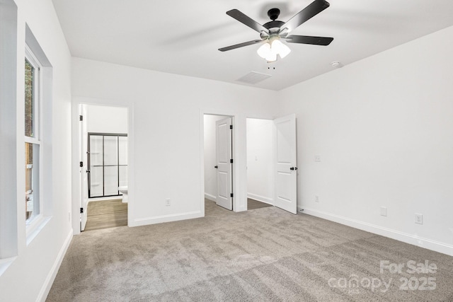 unfurnished bedroom with light carpet and ceiling fan