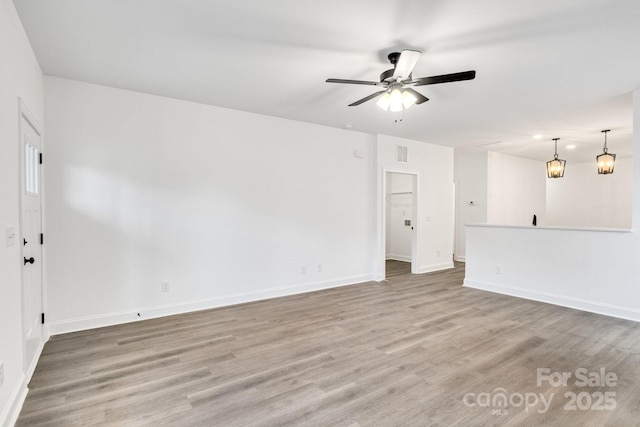 unfurnished room featuring hardwood / wood-style flooring and ceiling fan