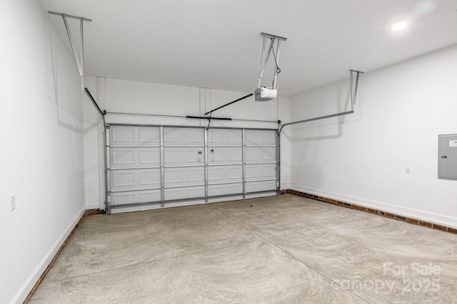 garage with electric panel and a garage door opener