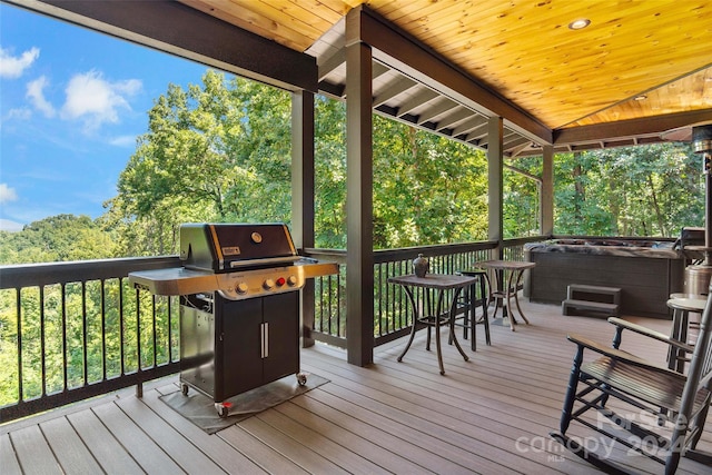 wooden deck featuring area for grilling