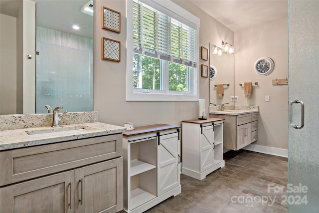 bathroom featuring vanity and an enclosed shower