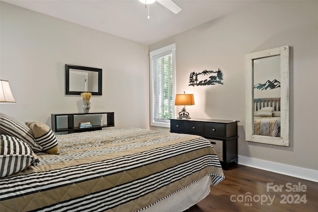 bedroom with ceiling fan and dark hardwood / wood-style flooring