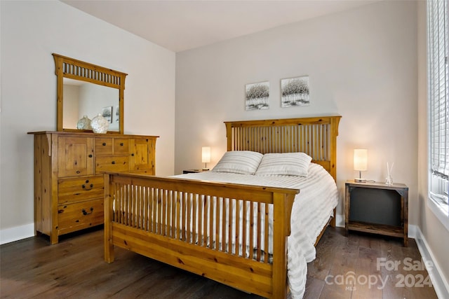 bedroom featuring dark wood-type flooring