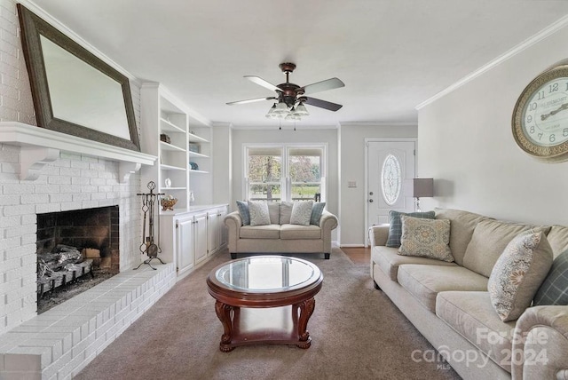 living room with carpet flooring, ceiling fan, a fireplace, and crown molding