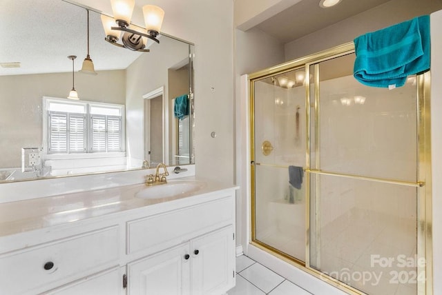 bathroom with tile patterned flooring, walk in shower, vaulted ceiling, and vanity