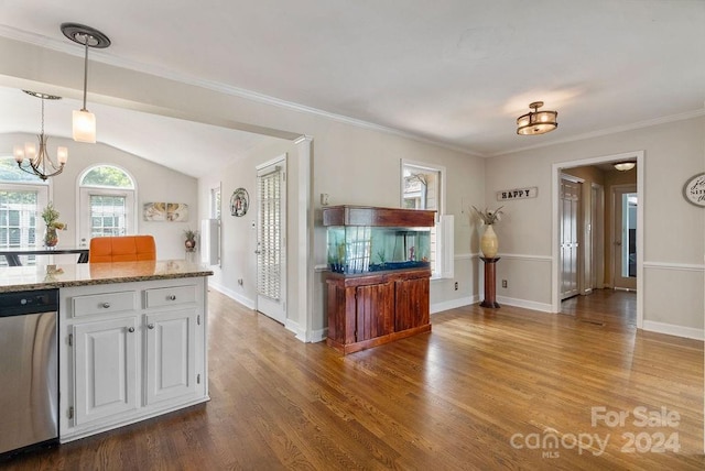 kitchen with light stone countertops, hardwood / wood-style floors, stainless steel dishwasher, lofted ceiling, and white cabinets