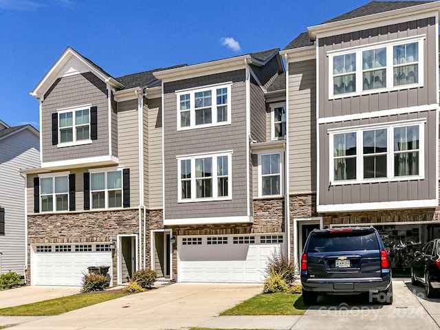 multi unit property featuring a garage