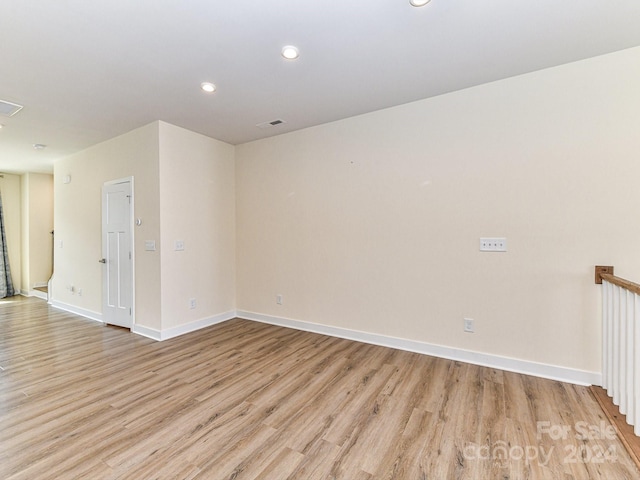 spare room with light hardwood / wood-style floors