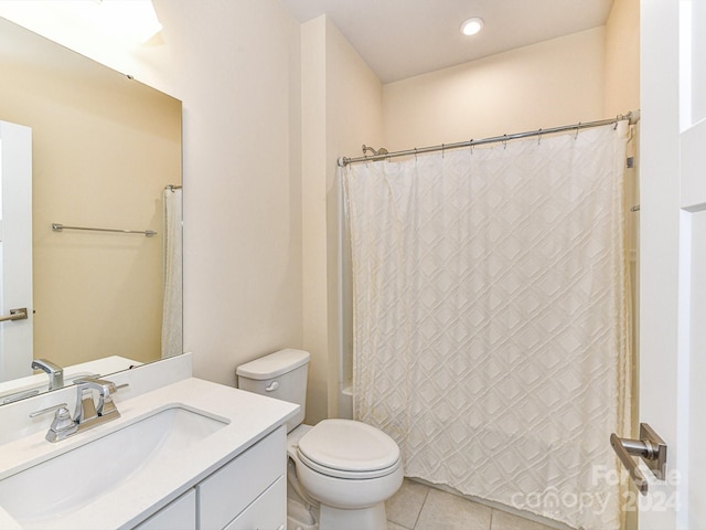 full bathroom featuring tile patterned floors, shower / bath combo, toilet, and vanity