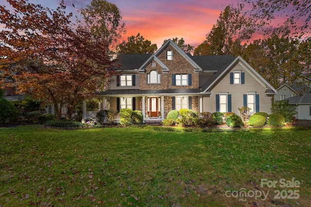 view of front of property with a yard