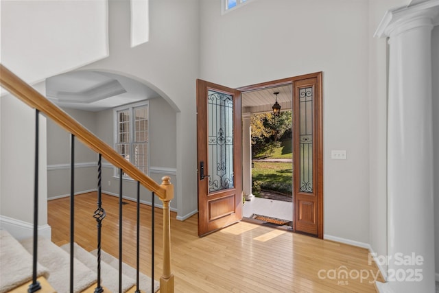 foyer entrance with plenty of natural light and light hardwood / wood-style flooring