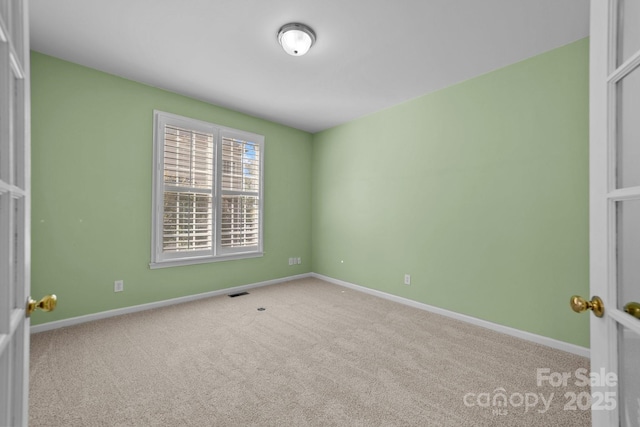 empty room featuring carpet flooring