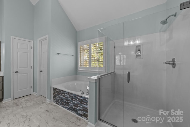 bathroom with independent shower and bath and lofted ceiling