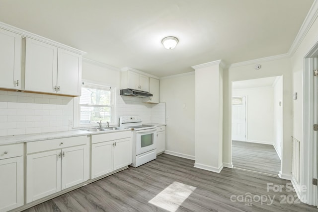 kitchen with light hardwood / wood-style floors, white cabinetry, sink, electric stove, and decorative backsplash