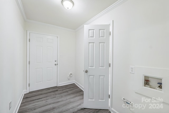 laundry room with crown molding, hookup for a washing machine, and hardwood / wood-style floors