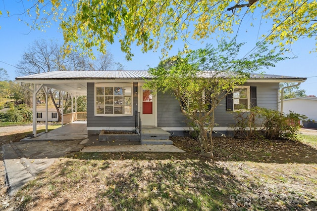 view of front of home featuring a carport