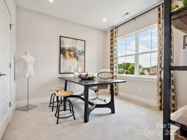 dining area with visible vents, baseboards, and light colored carpet