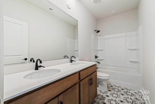 full bathroom featuring vanity, toilet, washtub / shower combination, and tile patterned flooring