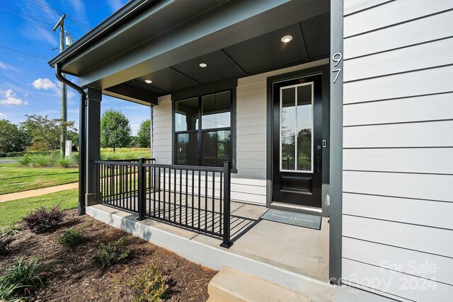 entrance to property featuring covered porch