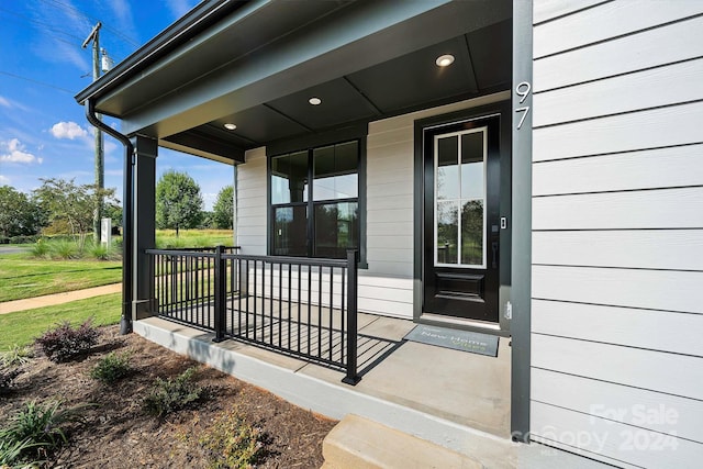 property entrance with covered porch