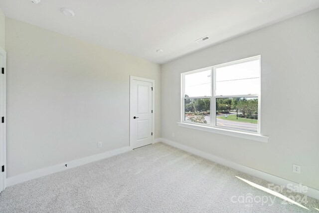 view of carpeted spare room